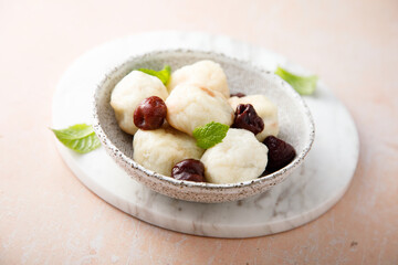 Homemade cottage cheese dumplings with cherry