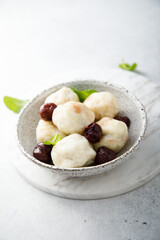 Homemade cottage cheese dumplings with cherry