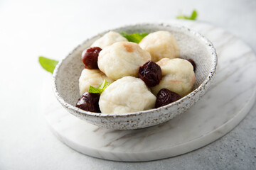 Homemade cottage cheese dumplings with cherry
