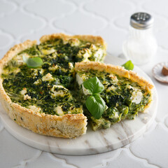 Homemade quiche with spinach and feta