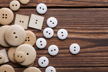 Wooden buttons on a wooden background