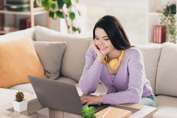 Photo of lovely young teen girl work study netbook dressed violet garment spacious house bright indoors room