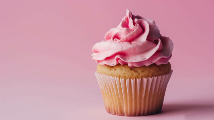 Scrumptious pink cupcake against a pink background.