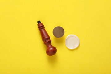 Vintage personal stamp and wax seal on yellow background