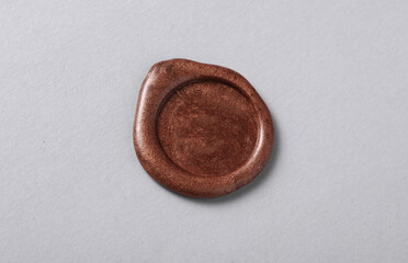Brown wax seals on a gray background