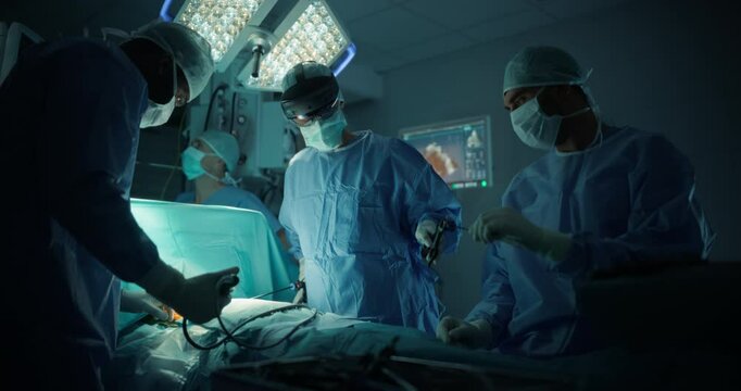 Female Surgeon is Equipped with an Augmented Reality Headset, Relies on Virtual Overlays to Make Quick, Informed Decisions as Nurses and Assistants Offer Steady Support During the Surgical Procedure