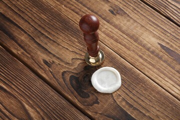 Vintage personal stamp and wax seal on wooden background