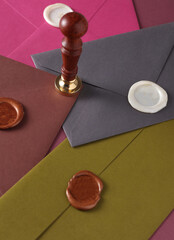 Colored Envelopes with wax seal and vintage stamp. Gift certificate, wedding invitation