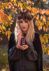 Candle burns in woman hands, power of occultism, pagan or wicca concept