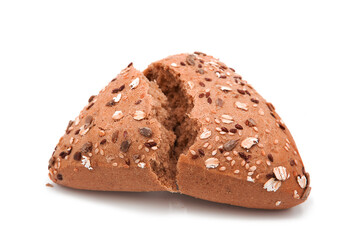 Fitness bread. Broken loaf of organic bran bread with seeds and sesame isolated on white background. Assortment of bakery products.	