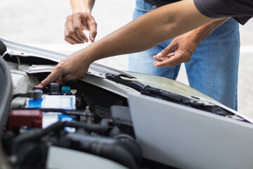 car service center mechanics are checking condition car and engine make sure they are ready use and in perfect condition according center warranty. periodic vehicle inspections for safety in driving.