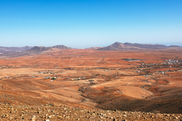 Beautiful volcanic landscape of some small villages in a desert valley. Hiking through Fuerteventura. Canary Islands, Spain. Betancuria Rural Park.