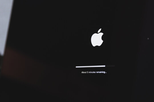 Apple macbook laptop update in progress. Updating computer mac os