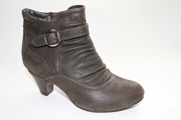 Women's Winter Boots and Shoes. On a white background. Side view. Unbranded model.