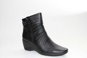 Women's Winter Boots and Shoes. On a white background. Side view. Unbranded model.