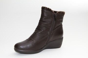 Women's Winter Boots and Shoes. On a white background. Side view. Unbranded model.