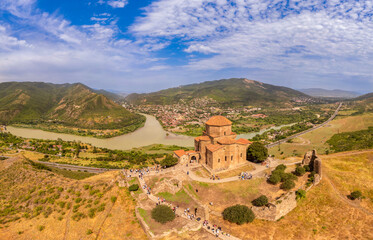 Aerial top view of ancient Jvari Monastery is a VI century Georgian Orthodox monastery. Holy Cross...