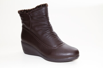 Women's Winter Boots and Shoes. On a white background. Side view. Unbranded model.