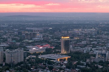 Panoramic view of the city of Almaty from the observation deck, sunset, summer time. Sights of Kazakhstan.