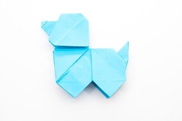 Paper dog on white background. Origami dog. Nature concept