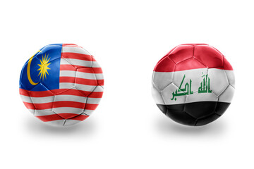 football balls with national flags of iraq and malaysia ,soccer teams. on the white background.