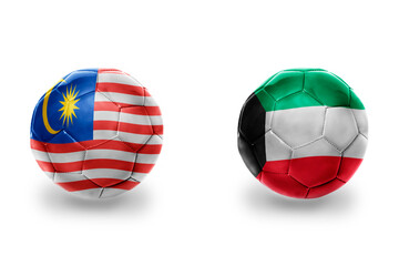 Obraz premium football balls with national flags of kuwait and malaysia ,soccer teams. on the white background.
