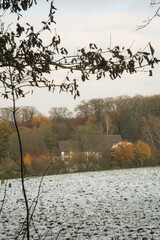 Autumn cowered with snow field, Germany