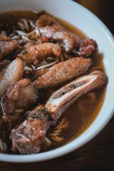 Pork chop noodles, a classic street food in Macau, China