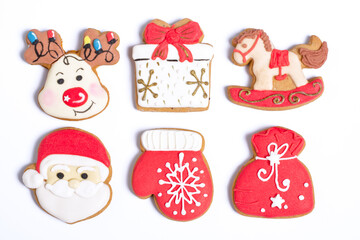 Christmas background with homemade gingerbread cookies on white, isolated Christmas handmade gingerbread cookies on white background, Christmas holidays desserts, top view