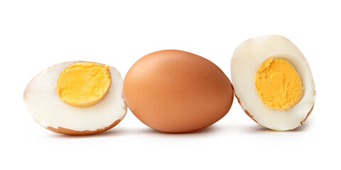 Side view of boiled or cooked brown chicken eggs with halves and egg yolk in stack isolated on white background with clipping path