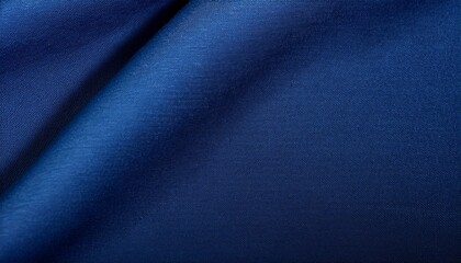 微細な糸の織りが魅力的な深いネイビーブルーの布地テクスチャ、落ち着きと奥行きのある背景
