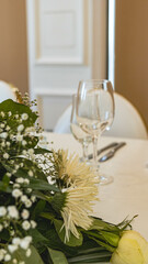 Beautiful flowers decorated on the table. Tables set for an event party or wedding reception.