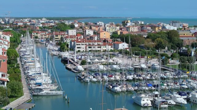 beautiful yachts and motorboats of Darsena dell'Orologio in Caorle, the Metropolitan City of Venice, Italy