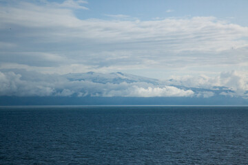 Iceland mountains with clouds and ocean