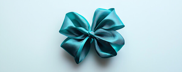 Turquoise ribbon bow on white background for decoration