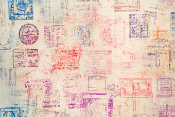 Naklejka premium Background with various stamps in passport. Travel texture in the form of stamps in passport 