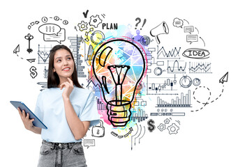 Woman holding a tablet and thinking with a colorful lightbulb and business doodles on a white...