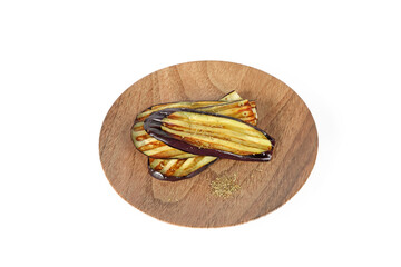 Grilled eggplants on a plate on white background