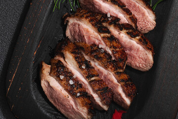 Fried duck breast with fresh orange and ginger, ready to eat food. Domestic cuisine, poultry meat