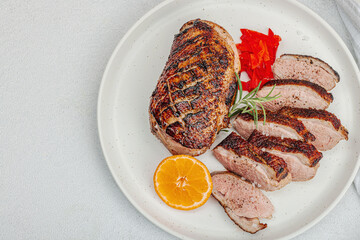 Fried duck breast with fresh orange and ginger, ready to eat food. Domestic cuisine, poultry meat