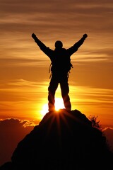 Fototapeta premium A silhouette of a hiker standing atop a mountain during sunset