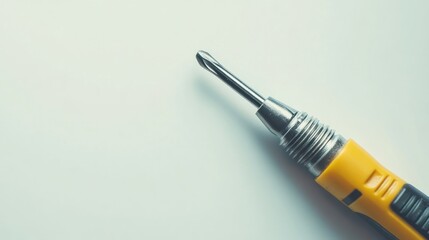 A close-up of a precision screwdriver, highlighting its tip and grip.