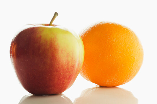 USA, New Jersey, Chatham, Studio shot of apple and orange on white background