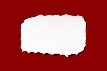Torn peace of paper on red background