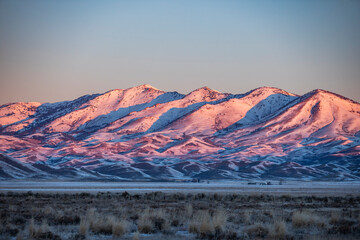 Snow covered hills at sunrise