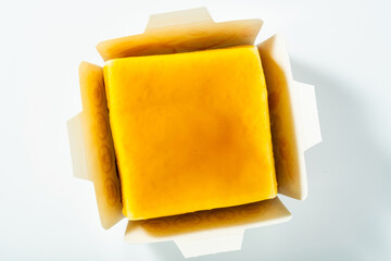 mango cheesecake in a paper package. industrial food