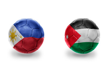 Obraz premium football balls with national flags of jordan and philippines ,soccer teams. on the white background.