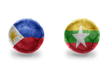 football balls with national flags of myanmar and philippines ,soccer teams. on the white background.