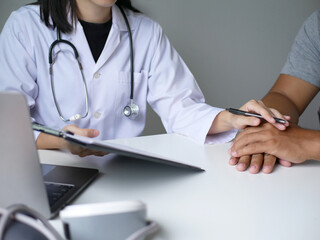 A female doctor who makes appointments with patients to listen to treatment results, perform physical examinations, explain medical information and diagnose diseases. medical and health concept