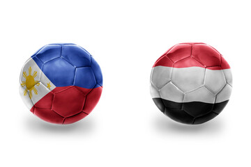 Fototapeta premium football balls with national flags of yemen and philippines ,soccer teams. on the white background.